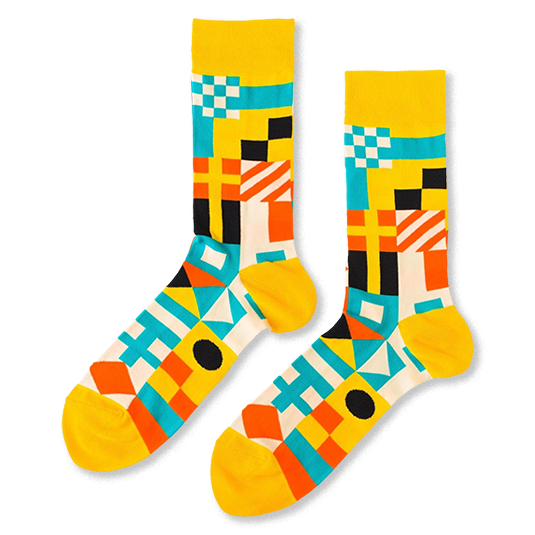 Pair of crew socks with a vibrant geometric nautical flag pattern in yellow, blue, orange, black, and white.