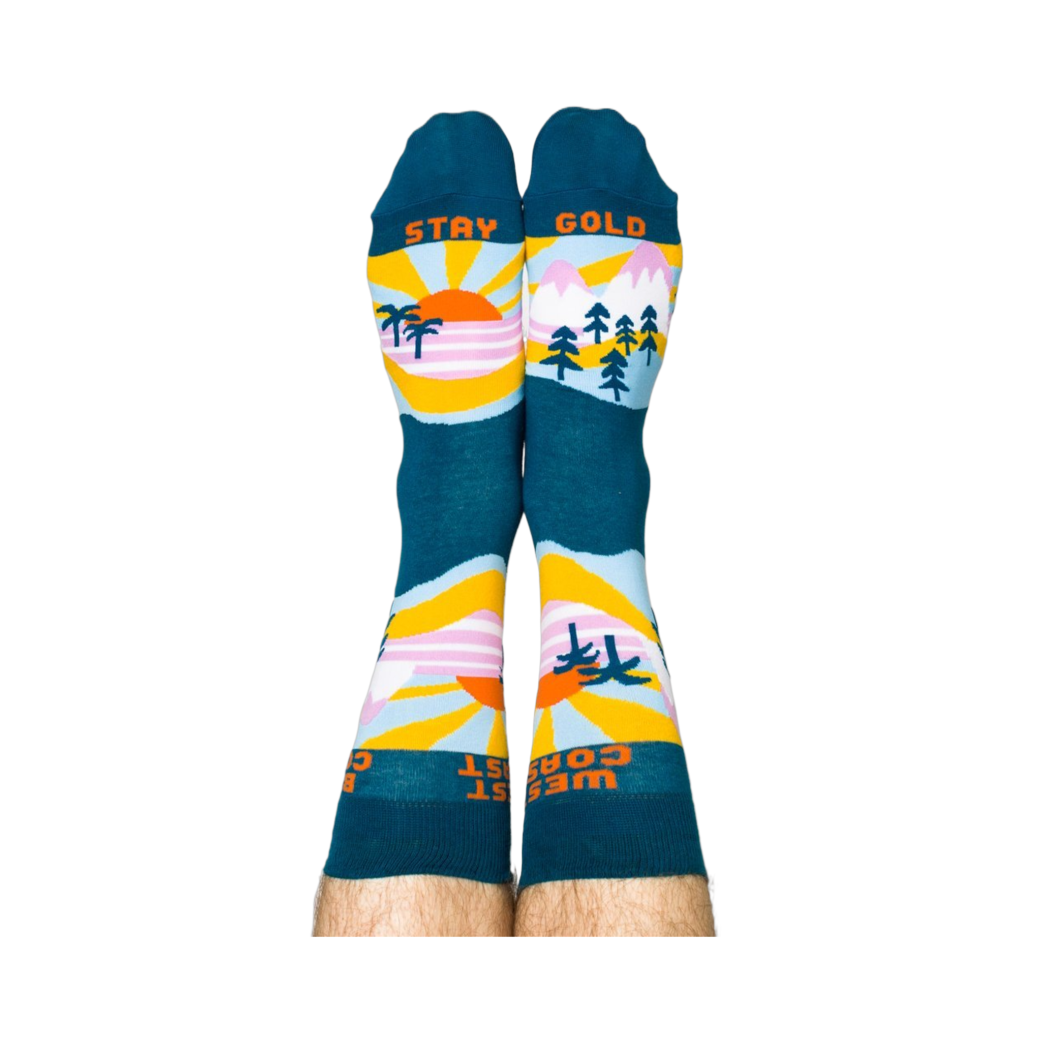 A person wearing the West Coast Best Coast socks, soles up. The 'STAY GOLD' text is visible on the bottoms.