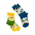 Two pairs of socks: the blue West Coast Best Coast design and a yellow and green version with similar patterns.