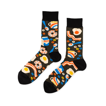 Pair of crew socks with a black background covered in a pattern of fried eggs, bacon, donuts, milk cartons, and coffee cups.