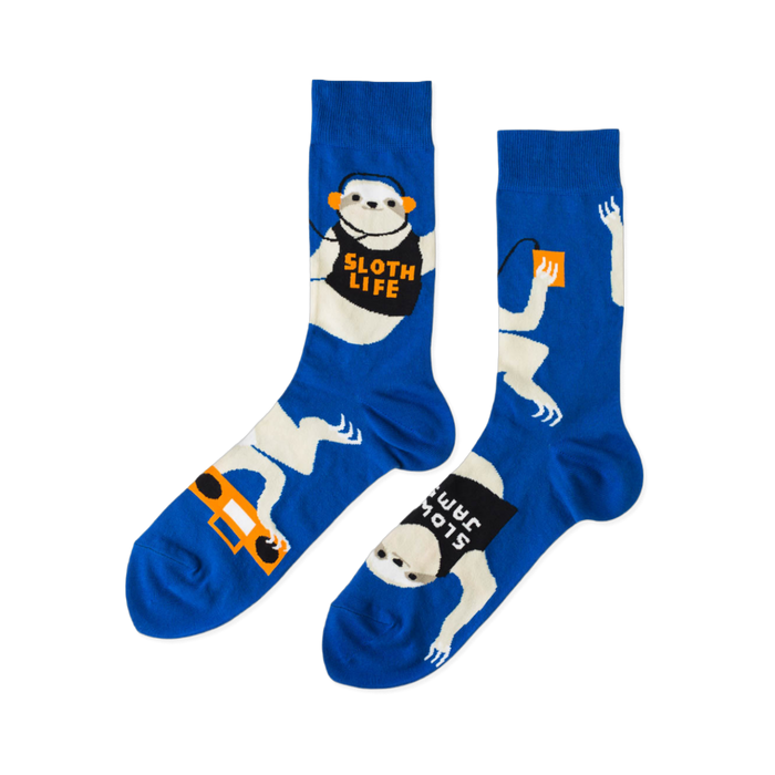Pair of royal blue crew socks with white sloths wearing orange headphones, holding boomboxes, and text 'SLOTH LIFE'. }}