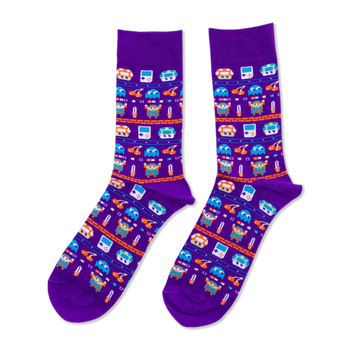 Purple crew socks with pixel art pattern: retro handheld consoles, orange mushrooms, blue ghosts, and sword-holding heroes.