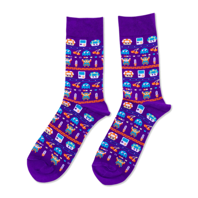 Purple crew socks with pixel art pattern: retro handheld consoles, orange mushrooms, blue ghosts, and sword-holding heroes.