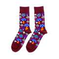 Pair of crew socks with a repeating pattern of colorful mushrooms on a dark red-brown background. Mushrooms are blue, orange, pink, white.