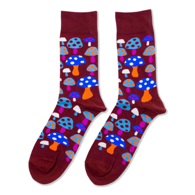 Pair of crew socks with a repeating pattern of colorful mushrooms on a dark red-brown background. Mushrooms are blue, orange, pink, white.