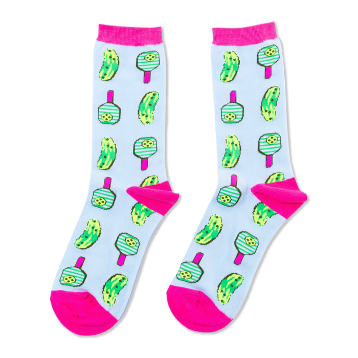 Pair of crew socks on light blue with neon pink cuffs, heels, and toes. Features green pickles and pickleball paddles with pink handles. }}