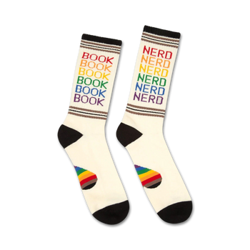white and black crew socks featuring a rainbow pattern of "book nerd" graphics.  