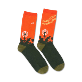 orange and green crew socks with a dandelion field and the words 'and still i rise' and 'maya angelou'.  