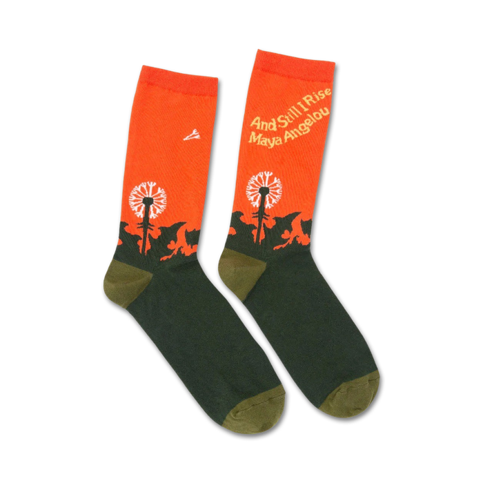 orange and green crew socks with a dandelion field and the words 'and still i rise' and 'maya angelou'.   }}