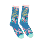 Close-up detail shot of the floral and gold lettering design on the 'Anne of Green Gables' socks.