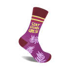 Purple crew socks with maroon cuffs, yellow text reading 'Stay Golden, Girls!', and a light purple leaf pattern.