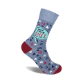 Crew socks in blue with a teal speech bubble saying 'Not This Shit Again'.  The sock also features small red and white triangles on a blue background. 