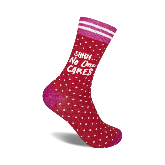 red socks with white polka dots and the words '{shhh... no one cares}' on the leg; pink toe, heel, and top; two pink stripes; crew length; men and women.  }}