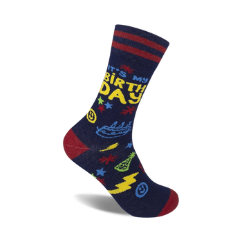 blue crew socks with red and white stripes at the top featuring "it's my birthday" in yellow letters. other festive images like stars and party hats also appear on the socks.  