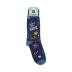 Lifestyle product shot of 'Don't Be A Dick' socks on a person's foot. The socks are folded over at the top.