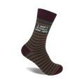 Crew socks in olive green with thin orange stripes and a maroon cuff. The text 'I DON'T ACTUALLY WORK HERE' is printed on the sock.