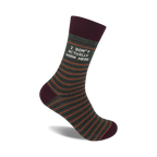 Crew socks in olive green with thin orange stripes and a maroon cuff. The text 'I DON'T ACTUALLY WORK HERE' is printed on the sock.