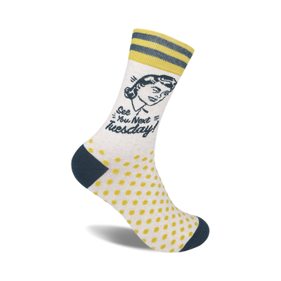 crew socks with yellow polka dots, blue stripes at the top, and a picture of a woman winking while saying "see you next tuesday".  