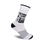 White crew socks with black stripes at the bottom and a design featuring black school supplies and the text 'Teaching Is My Jam'.