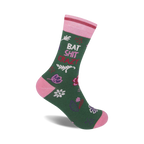 Green crew socks with pink accents. Features a playful 'Bat Shit Crazy' phrase and a whimsical floral pattern.