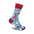 Crew socks in teal and red, featuring a cartoon Jesus with a party hat and balloon, surrounded by Christmas-themed designs.