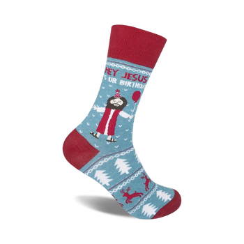 blue socks with cartoon jesus in party hat, red balloon, christmas trees, reindeer, "hey jesus...it's ur birthday" text.   