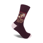 Maroon crew socks with a funny illustration of a person yawning and the text 'A yawn is a silent scream for coffee'.