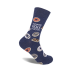 A navy blue crew sock with a playful 'Eat More Hole Foods' slogan and illustrated donuts in various colors and glazes.