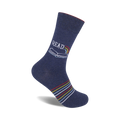 Navy blue crew socks with a colorful book and rainbow design and thin colorful stripes near the ankle.
