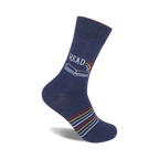 Navy blue crew socks with a colorful book and rainbow design and thin colorful stripes near the ankle.