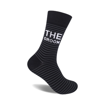 "black and gray striped crew socks with 'the groom' in white letters. perfect for the special man on his wedding day." 