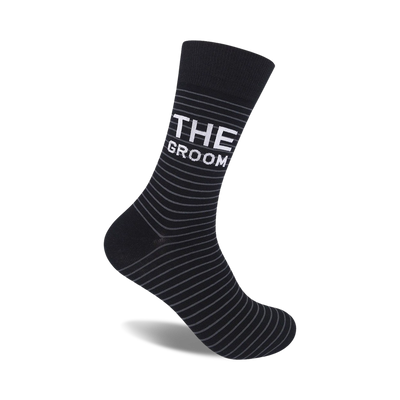 "black and gray striped crew socks with 'the groom' in white letters. perfect for the special man on his wedding day." 