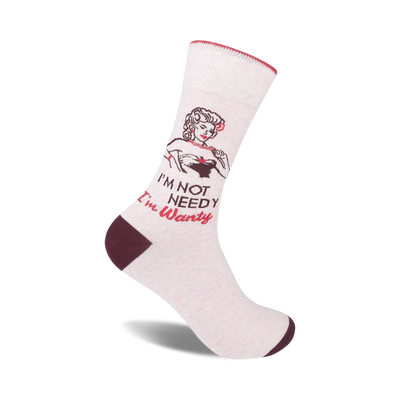 white crew socks with a smiling woman in a red bikini and the words "i'm not needy...i'm wanty" written in red and brown letters.  