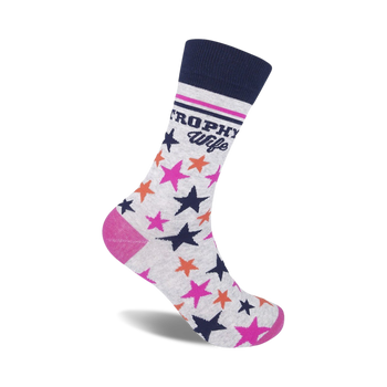 crew-length women's socks in gray with dark blue cuff, white background with "trophy wife" in dark blue, vertical pink stripes, and pink and orange stars.  