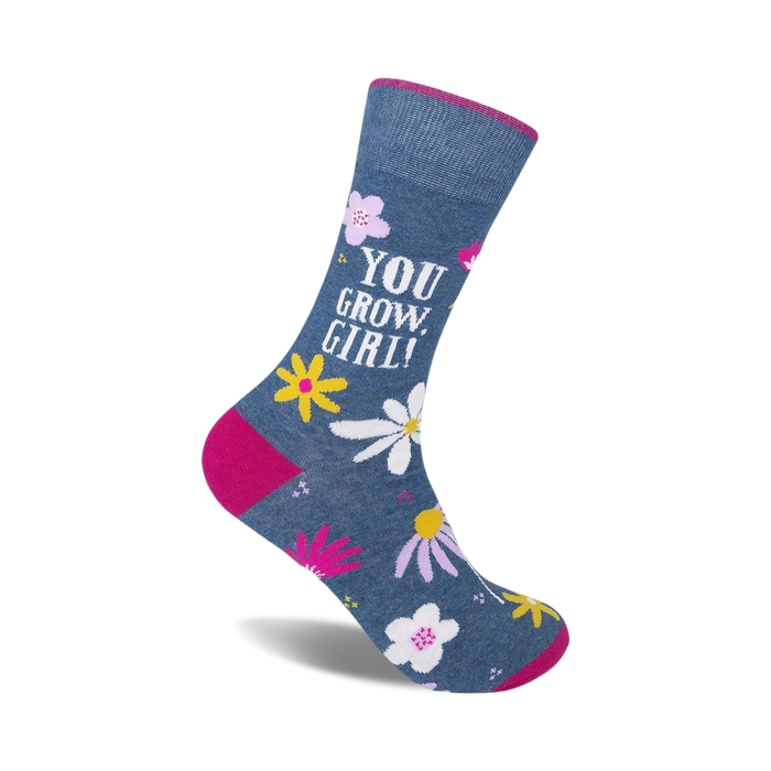 blue crew socks with pink toe, heel, and top feature white and yellow flowers and 