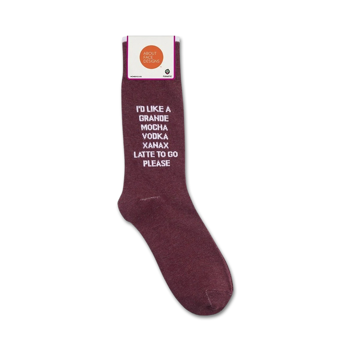 A pair of maroon socks with white text that reads: 