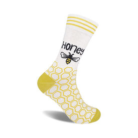 yellow hexagon bee print women's white crew socks, labeled "honey."  