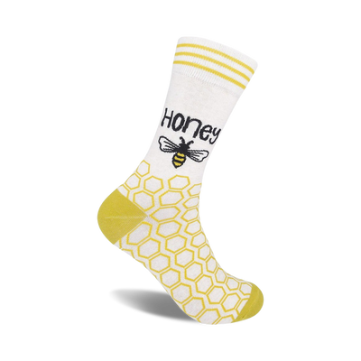 yellow hexagon bee print women's white crew socks, labeled "honey."  