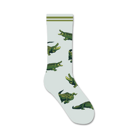 green alligators with white bellies and sharp white teeth on light blue background. women's crew socks. animal theme. cotton, nylon, spandex blend.   
