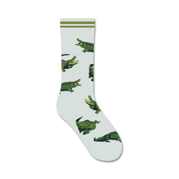 green alligators with white bellies and sharp white teeth on light blue background. women's crew socks. animal theme. cotton, nylon, spandex blend.   