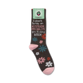 Lifestyle product shot of the 'I Don't Have An Attitude Problem' socks shown on a foot.  The socks are dark brown with pink, teal, and white flowers. The socks also feature a bold sassy message