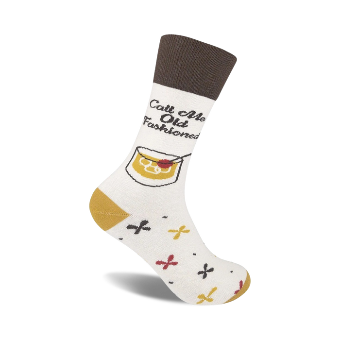 white crew socks with brown tops and text that says 'call me old fashioned'. whiskey-related graphic with cherry in glass. fun unisex socks.   }}
