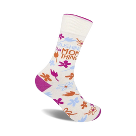purple-toe white crew socks with the words "crushing this mom thing" in white lettering and a floral pattern.   