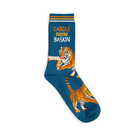 blue novelty socks with white toe, heel, and top. they feature a tiger biting a man's arm with the words 'carole fucking baskin' above the tiger.   