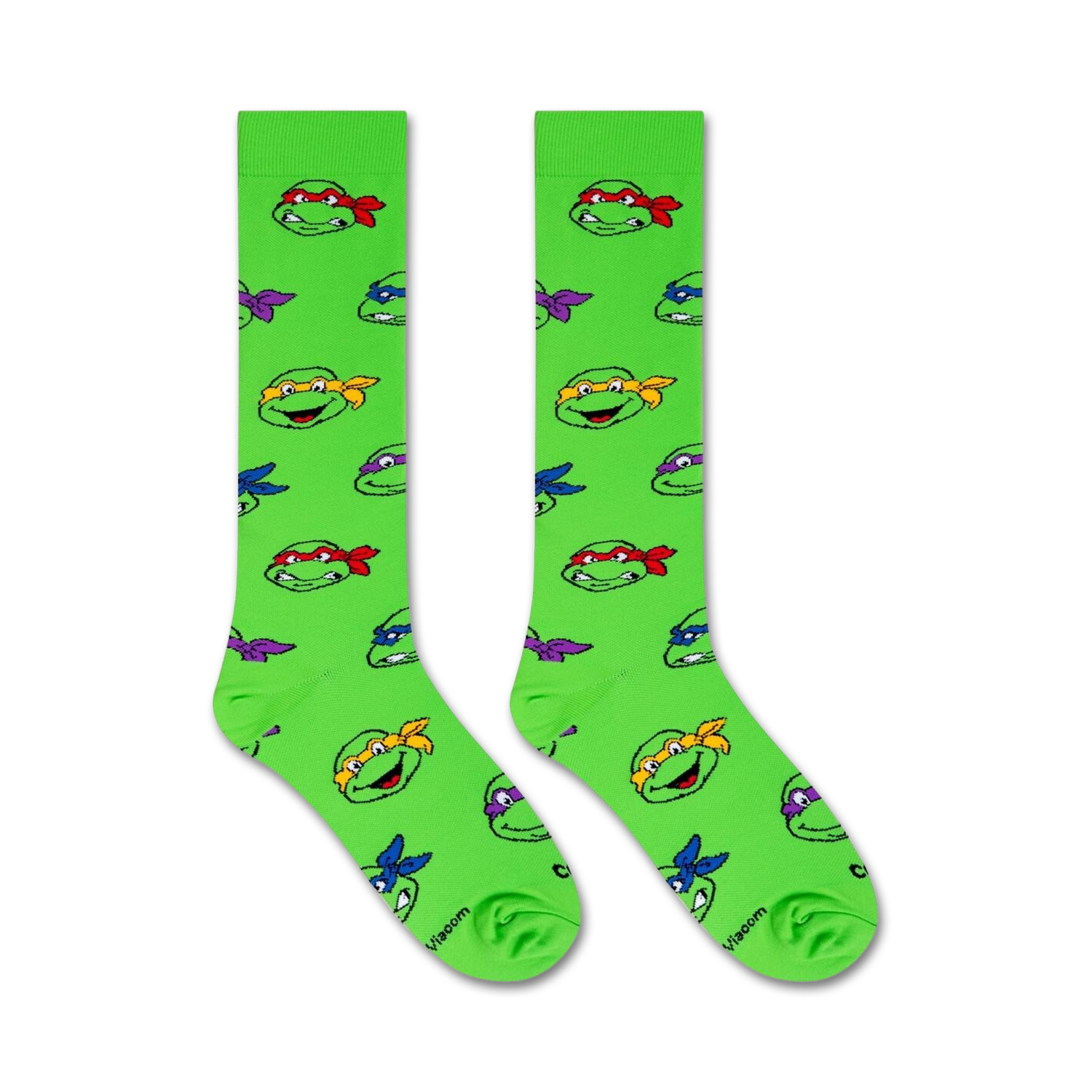 Flat lay image showing two TMNT knee-high socks on a white background.