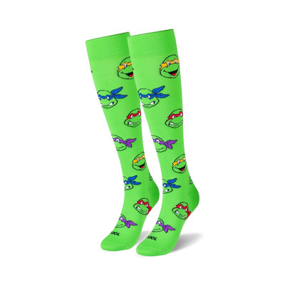 tmnt heads knee-high socks feature teenage mutant ninja turtles heads. green socks with different colored turtles. for men and women.  