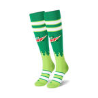 Pair of Mountain Dew-themed knee-high socks. Green and lime green colors, white stripes, and the Mountain Dew logo with flames.
