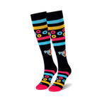 Pair of black knee-high socks with colorful stripes, Froot Loops-inspired rings, and a cartoon character. Pink, blue, and yellow accents.
