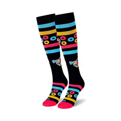 Pair of black knee-high socks with colorful stripes, Froot Loops-inspired rings, and a cartoon character. Pink, blue, and yellow accents.