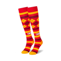 Pair of red and gold knee-high socks with a Cheez-It-inspired design. Features horizontal stripes and diamond patterns.